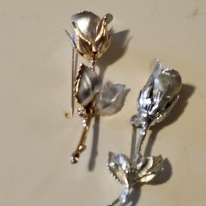 Two floral brooches